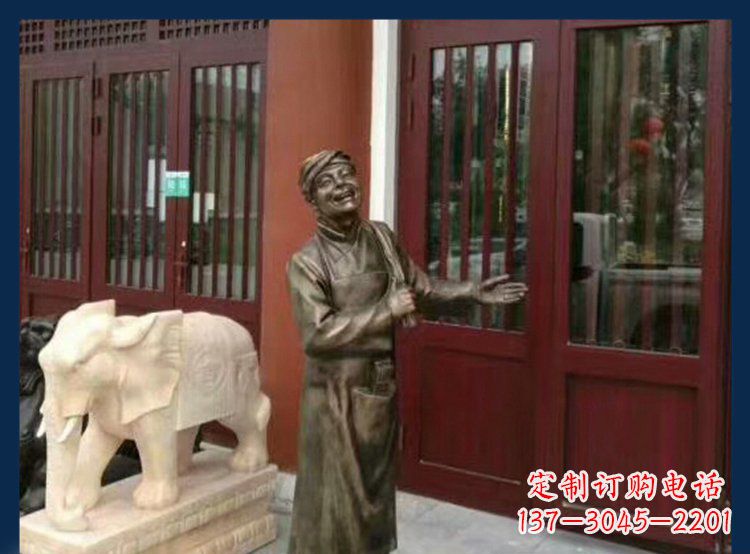 大连铜雕店小二酒店迎宾人物雕塑